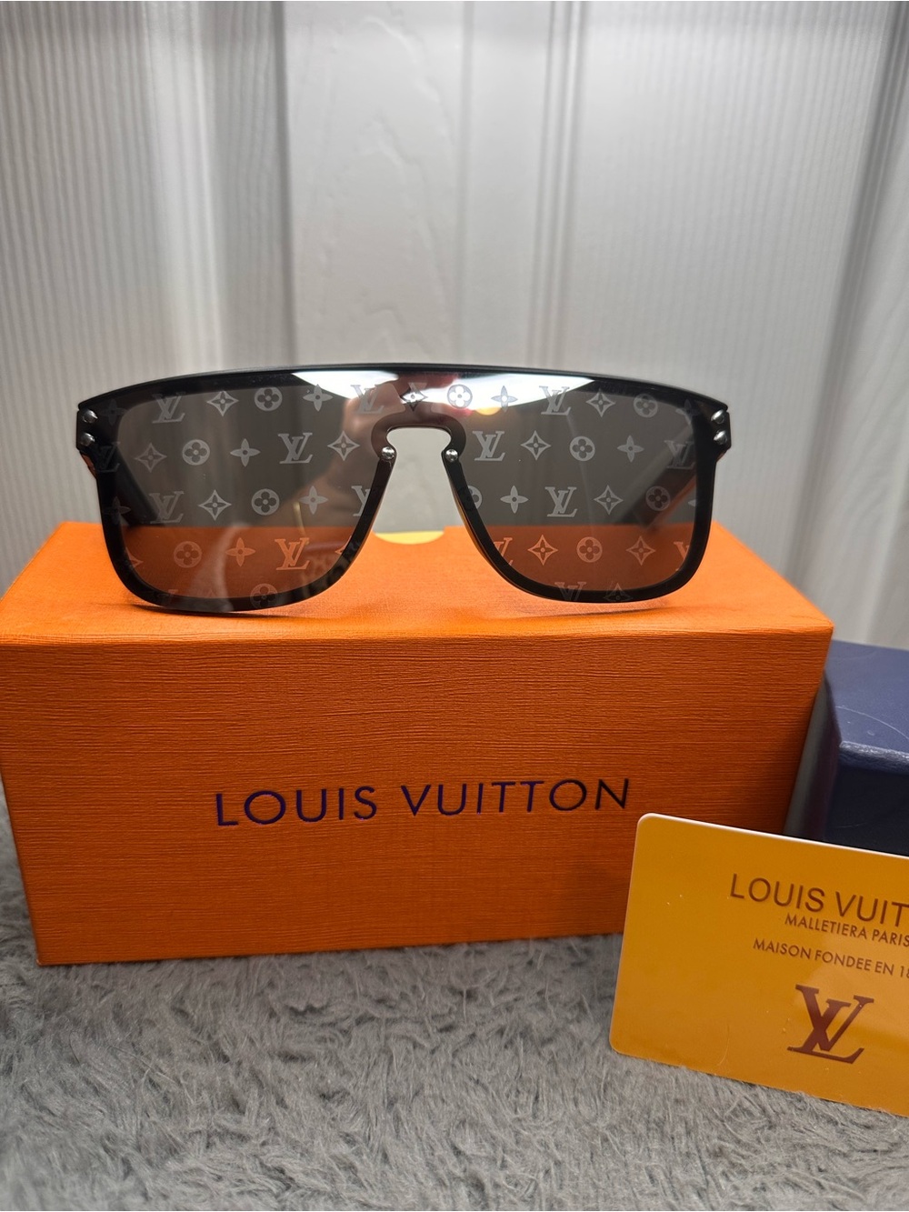 Men’s black shield monogram sunglasses.